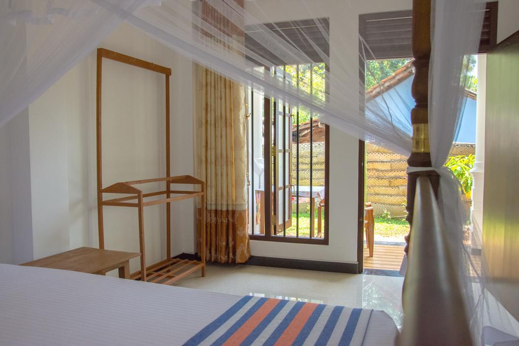 Garden Inn Мириса Екстериор снимка